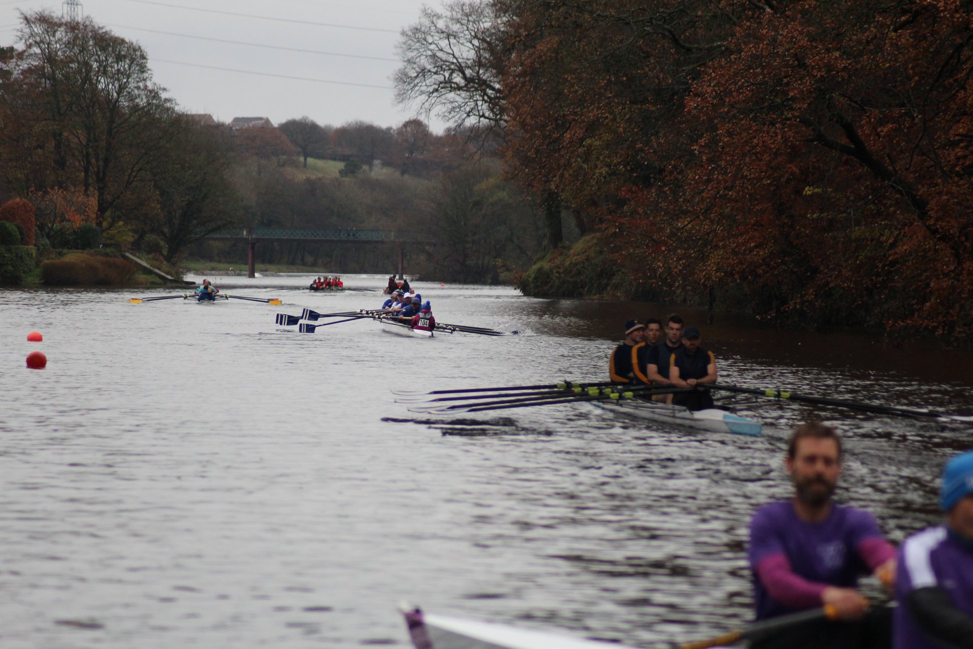 Crews racing on the River Lune in autumn during head season